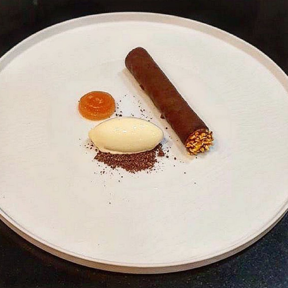 Chocolate cigar with sorbet quenelle and praline